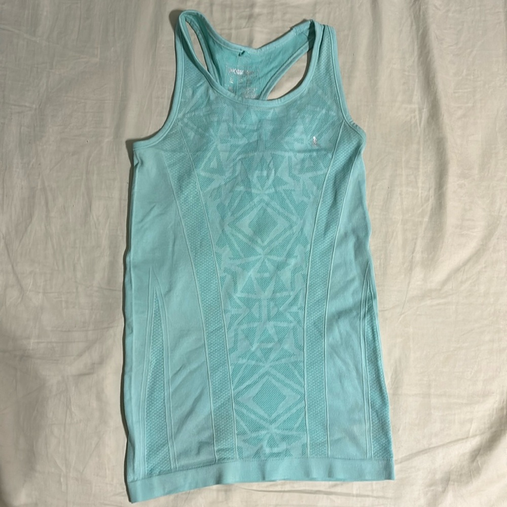 Light blue workout tank top, size 32-34. Lightly worn, good condition